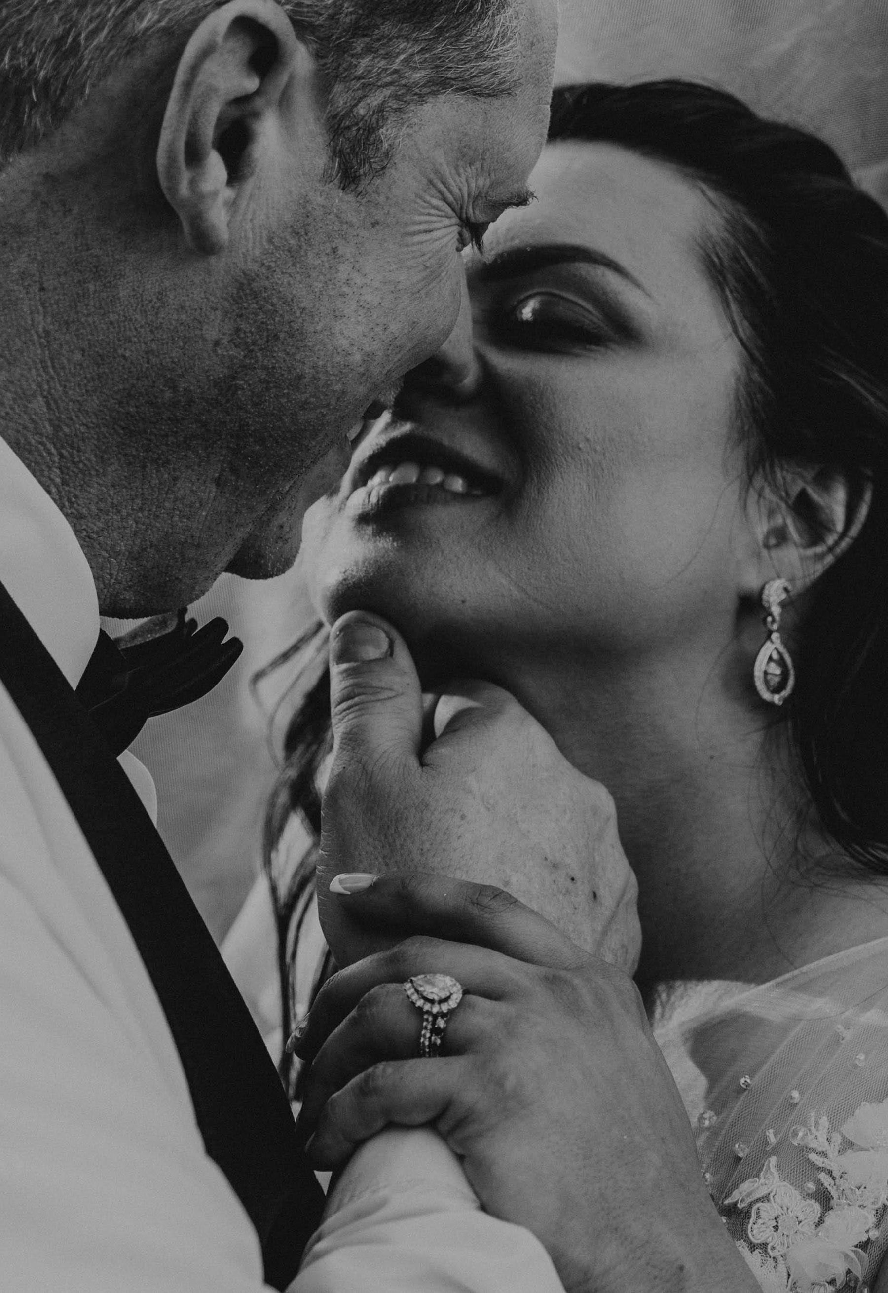 Black-and-white close-up of the bride and groom sharing a quiet moment, faces close — Dejeu Crew wedding photography